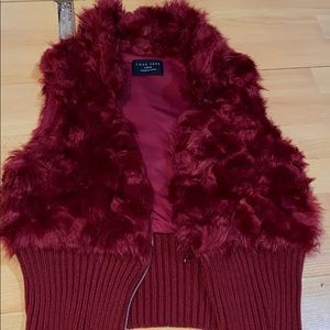 red fuzzy vest